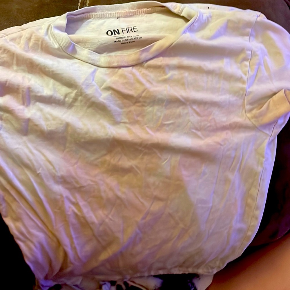 This is a tie die crop top that is 100% cotton. The original brand is “On Fire”.